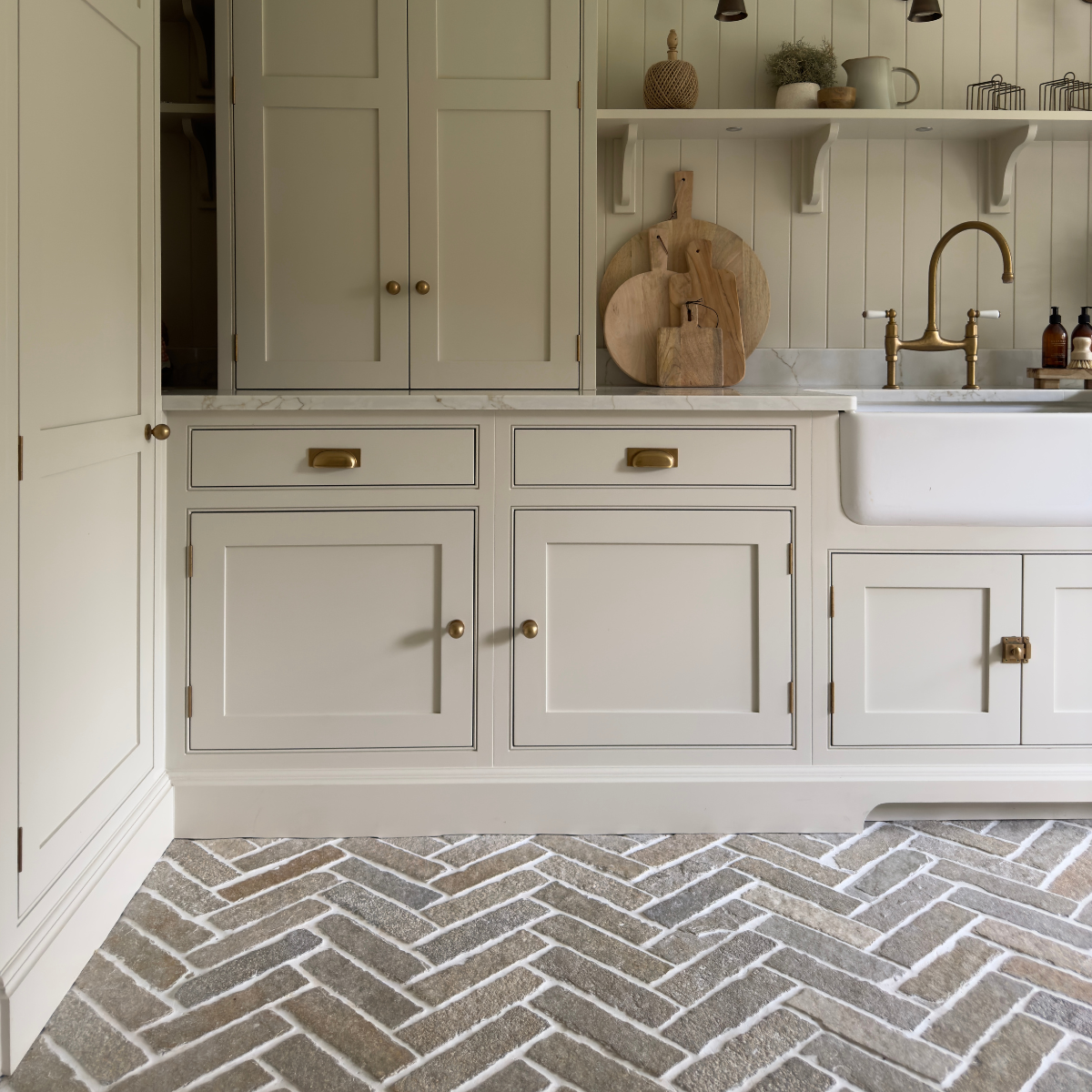 Lapicida herringbone floor tiles in utility room by Rachael Somerville Interiors