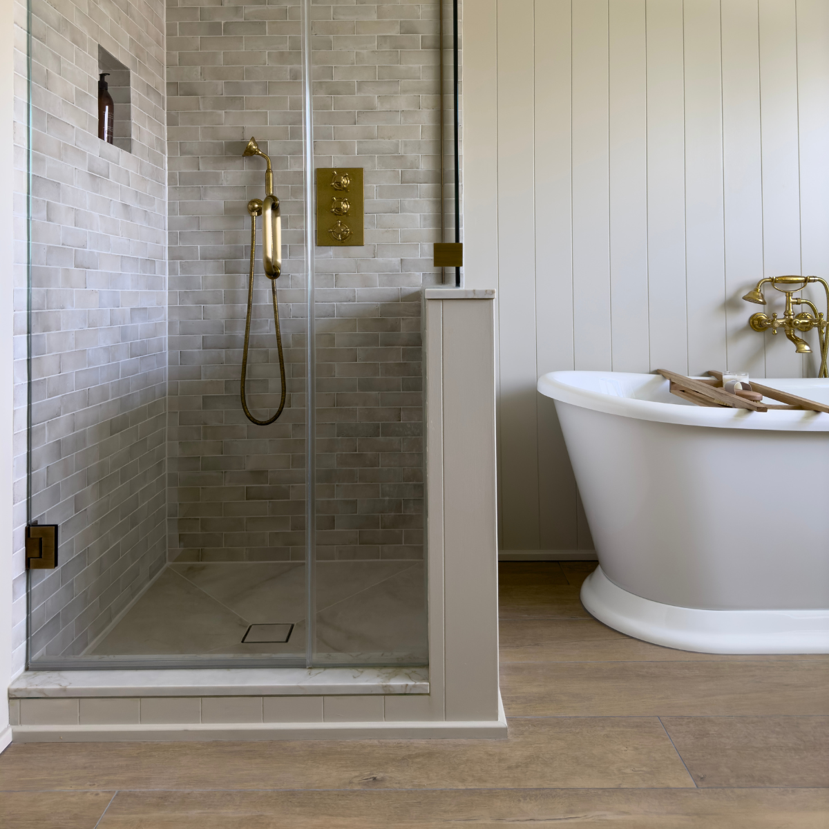 Lapicida Qualis Rice wall tiles and porcelain wood look floor tiles inside bathroom by Rachael Somerville Interiors