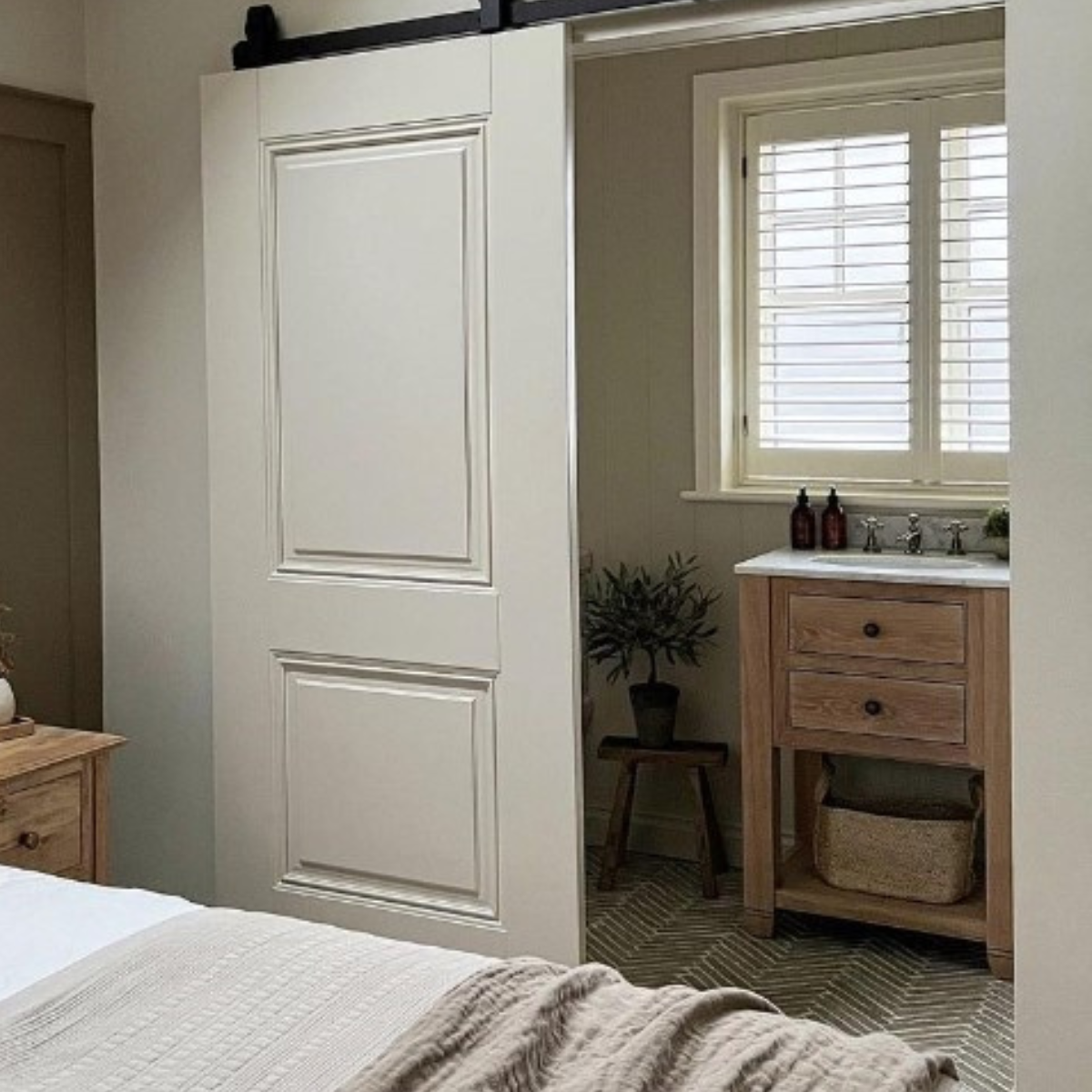 Lapicida herringbone floor tiles in bedroom by Rachael Somerville Interiors